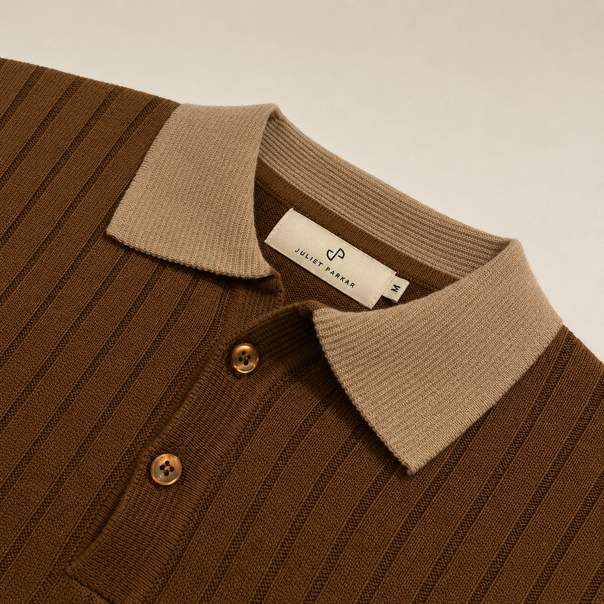 Close-up of the collar and button placket on the Men's Brown Contrast Collar Polo in 100% cotton by Juliet Parkar