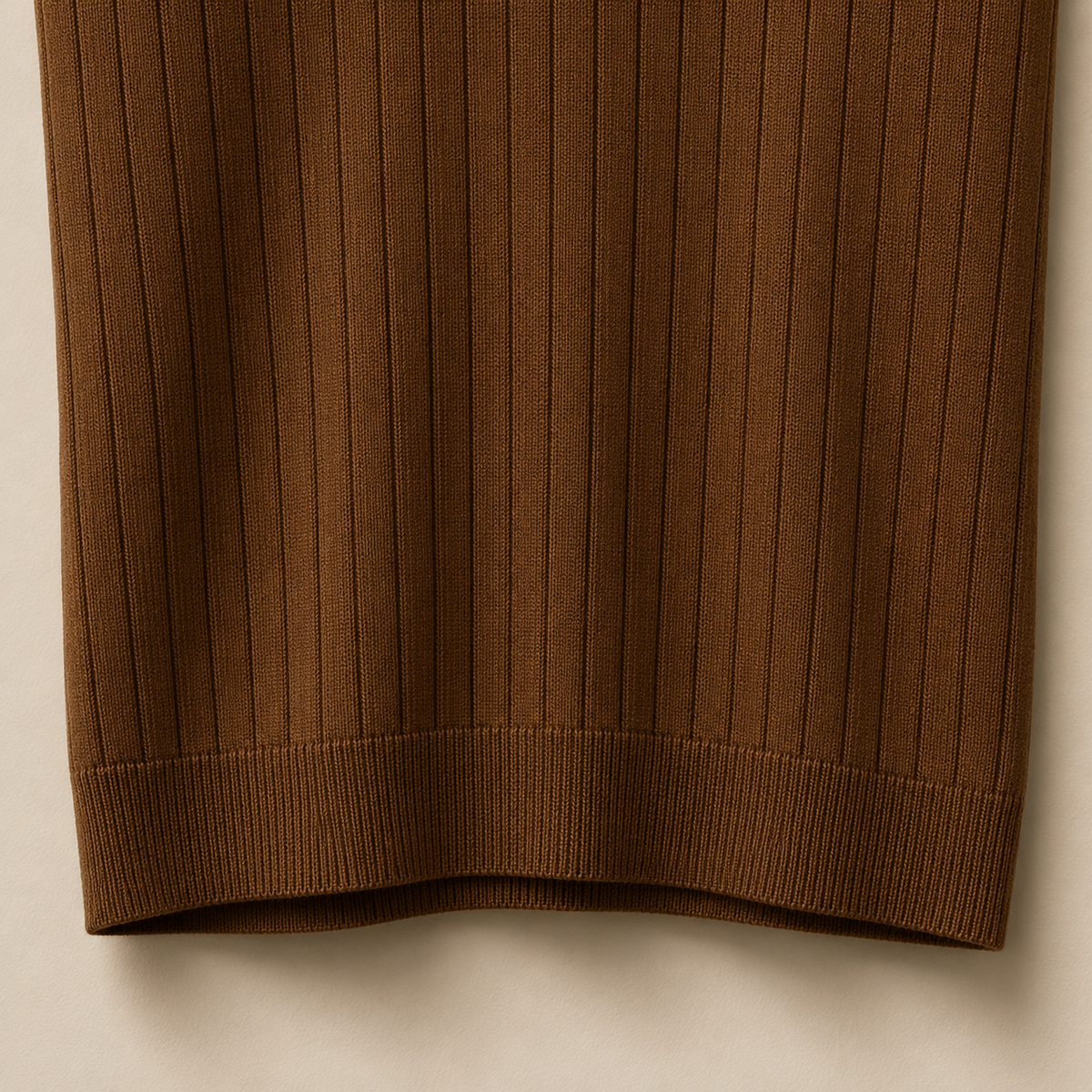 Close-up of the 100% cotton fabric and bottom hem stitching on the Men's Brown Contrast Collar Polo by Juliet Parkar