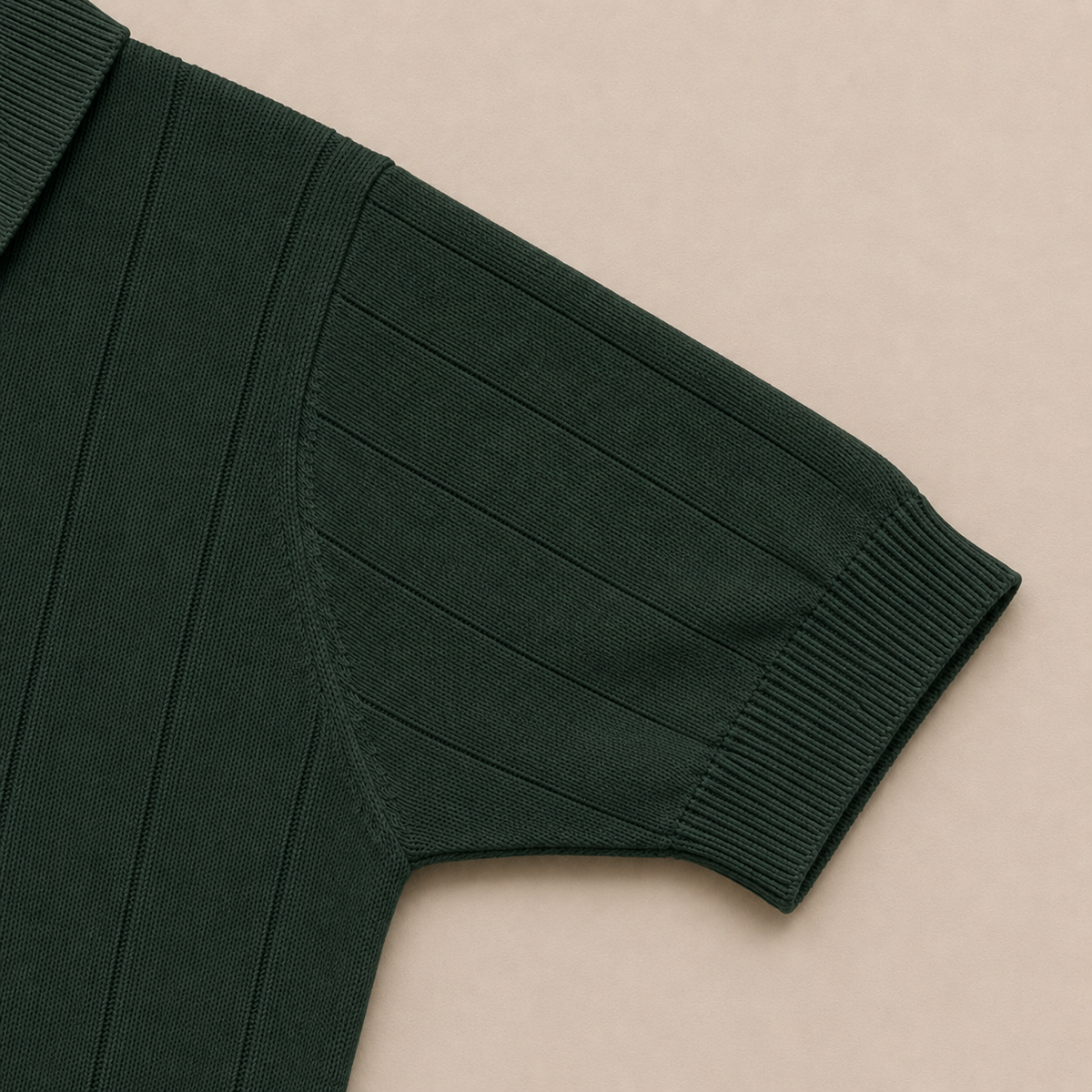 Close-up of the short sleeve with ribbed cuff on the Men's Forest Green Rib Knit Polo in 100% cotton by Juliet Parkar