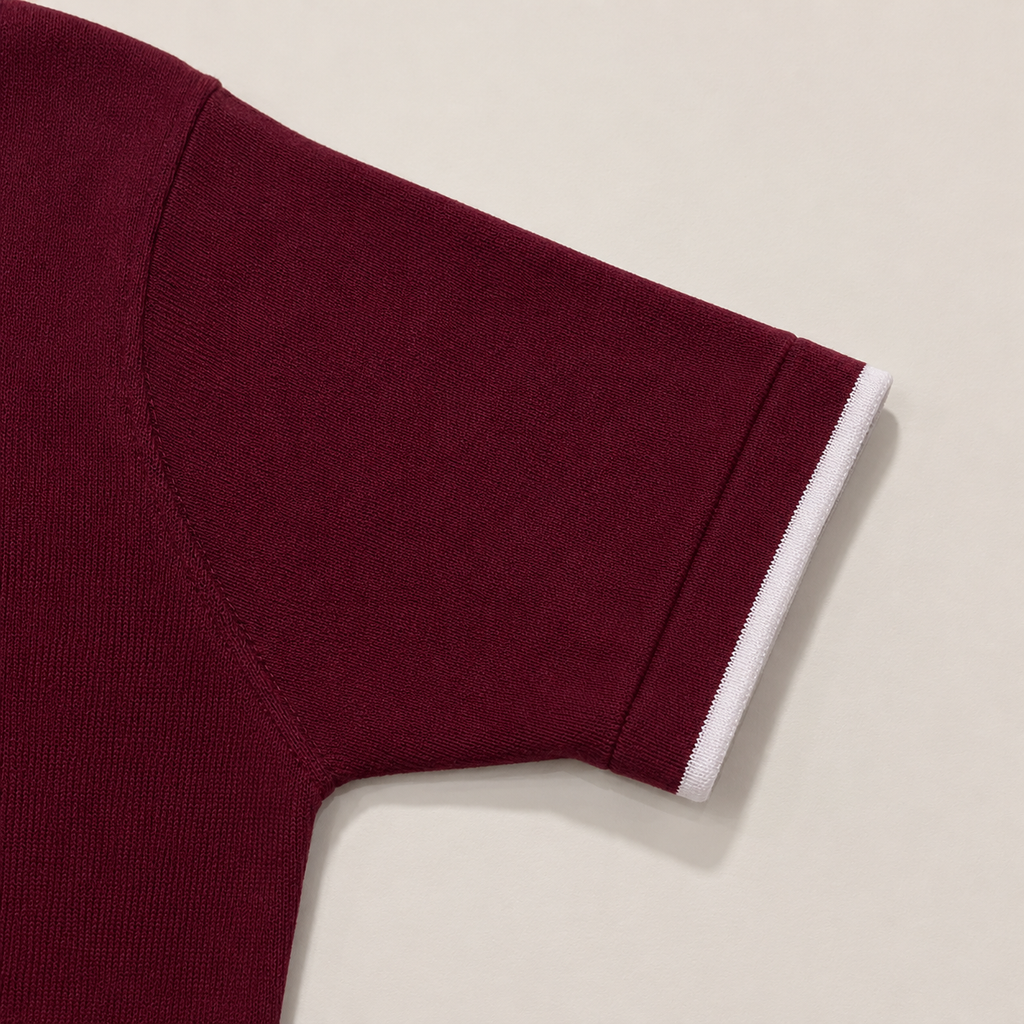 Close-up of the short sleeve with ribbed cuff on the Men's Maroon Classic Polo in 100% cotton piqué by Juliet Parkar
