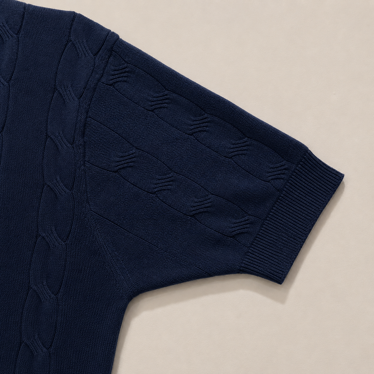 Close-up of the short sleeve with ribbed cuff on the Men's Navy Blue Classic Polo in 100% cotton by Juliet Parkar