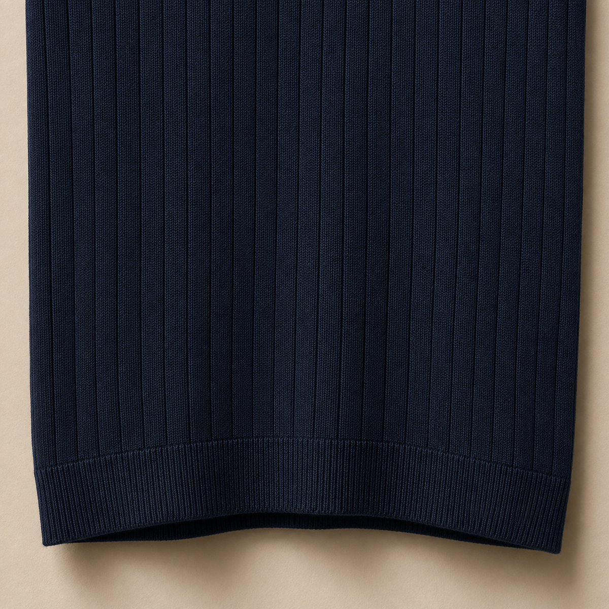Close-up of the 100% cotton fabric and bottom hem stitching on the Men's Navy Blue Contrast Collar Polo by Juliet Parkar